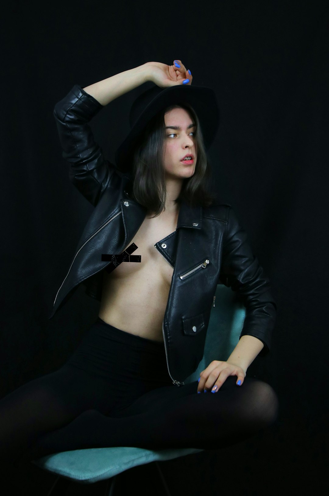 woman in black leather jacket and black skirt