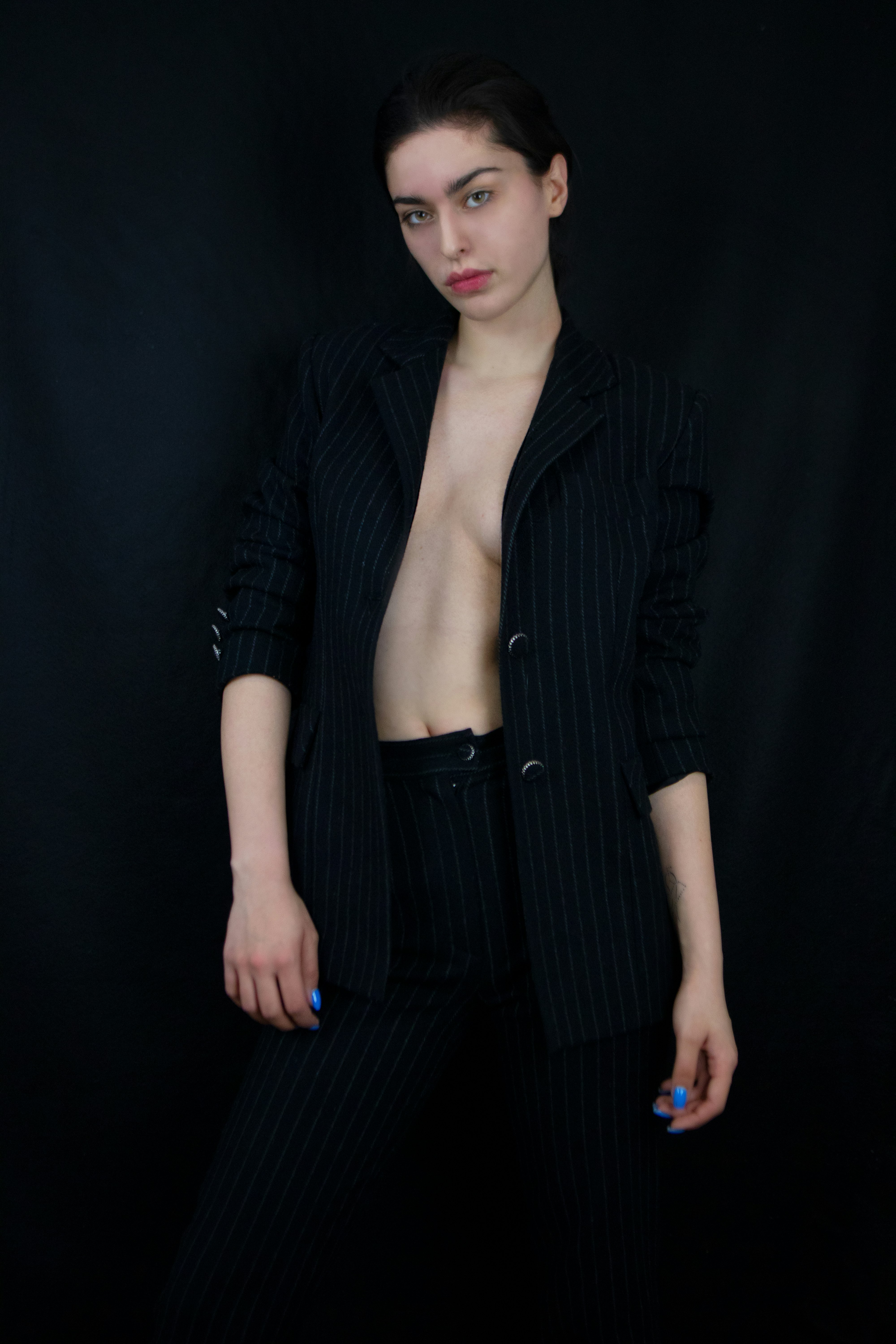woman in black cardigan standing