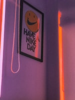 Smiling client holding a vibrant poster designed by Vibhu in a bright studio.