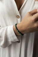 person wearing white button up shirt
