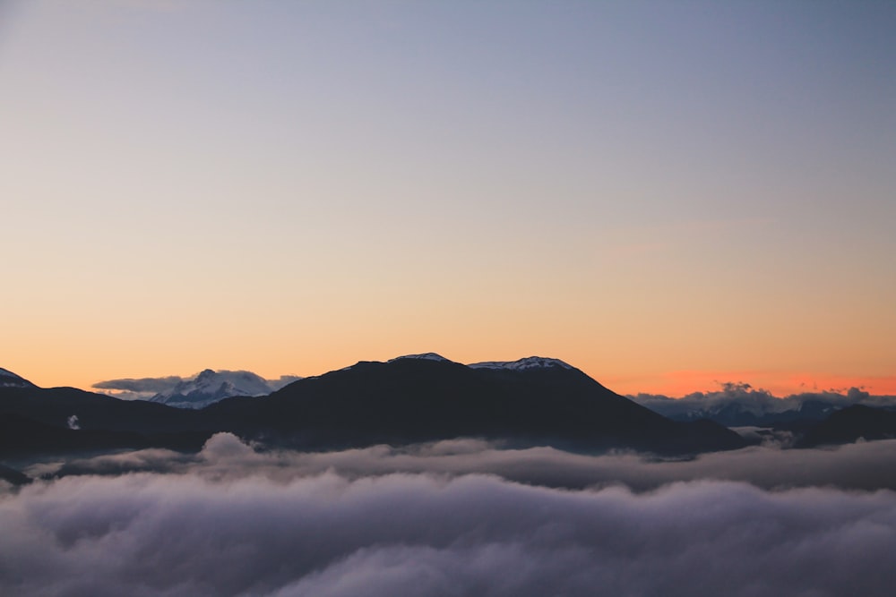 silhouette of mountains during sunset