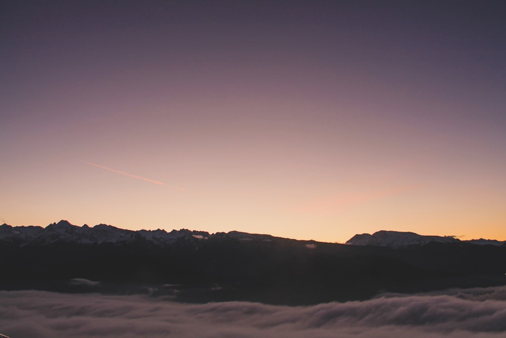 silhouette of mountain during sunset