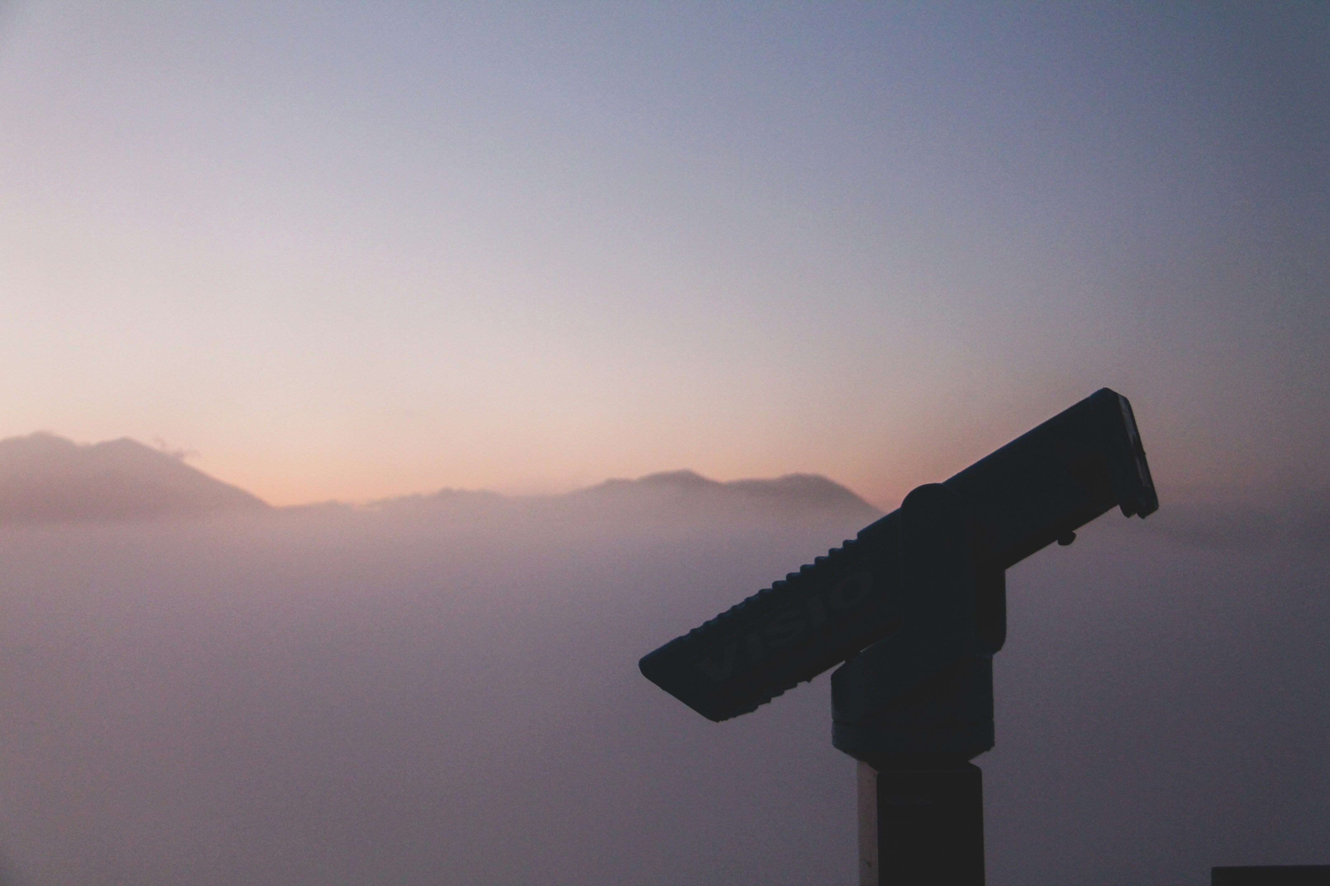 black metal stand on top of mountain during daytime