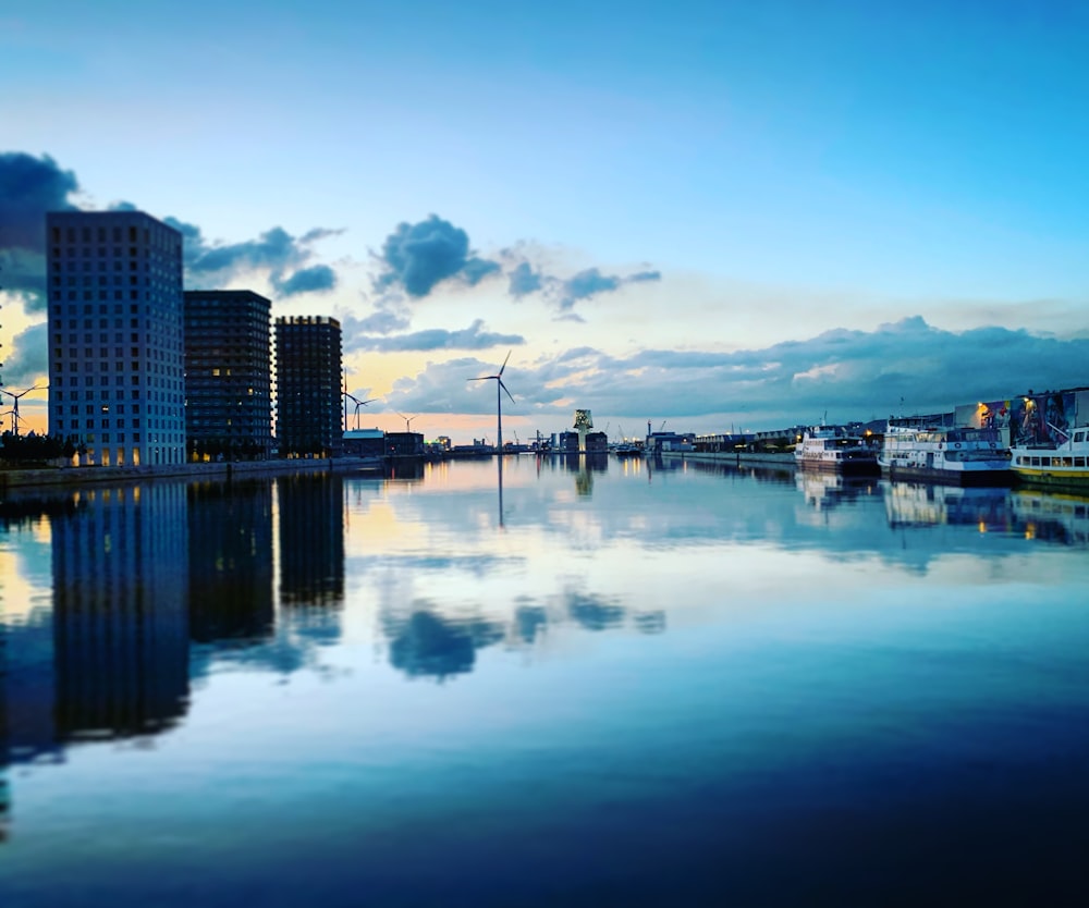 city skyline across body of water during daytime