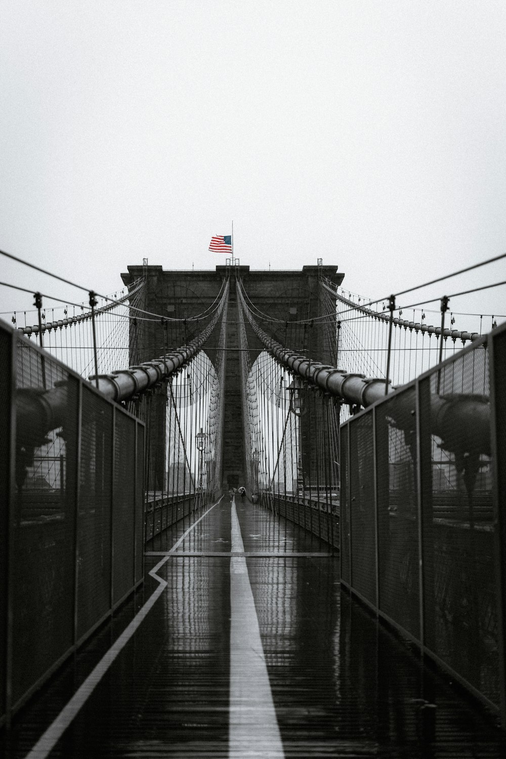 brown wooden bridge under white sky during daytime