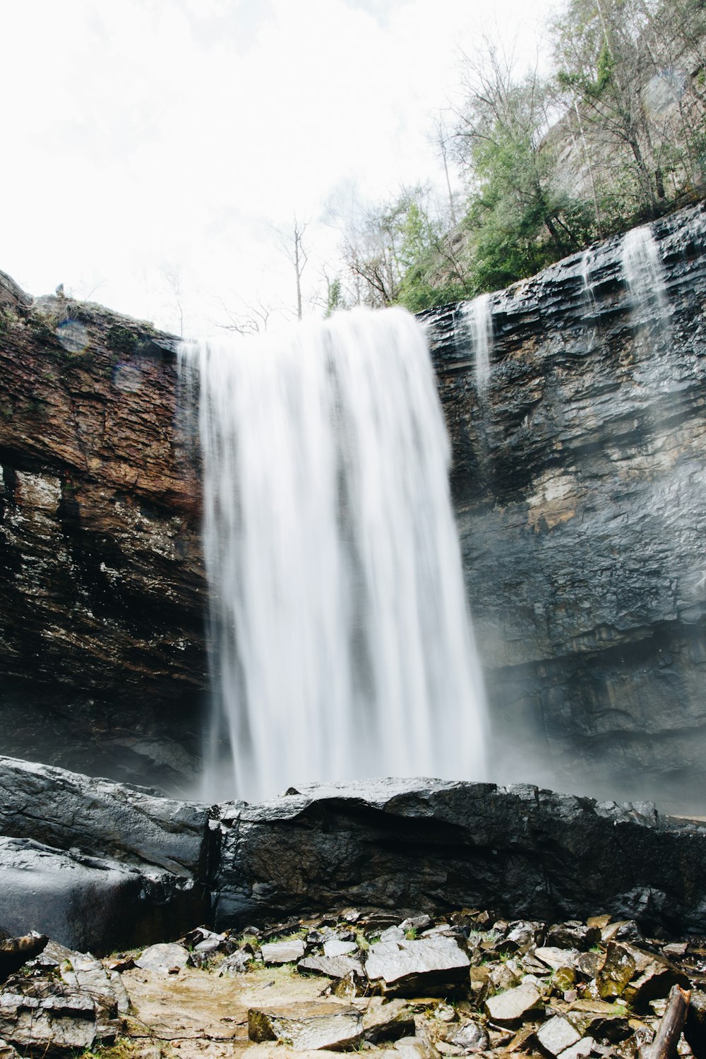 water falls on rocky mountain