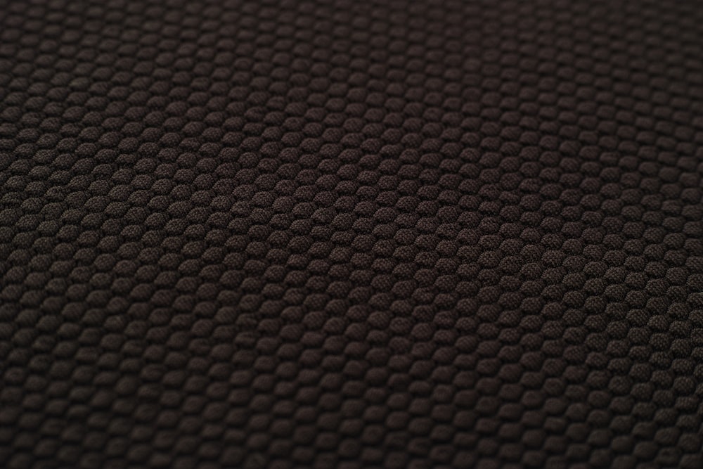 brown and black woven textile