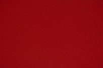 red textile in close up photography