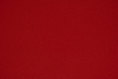 red textile in close up photography