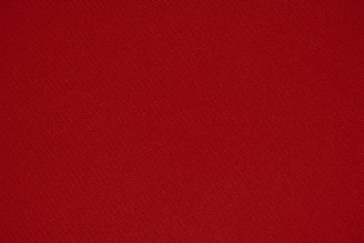 red textile in close up photography