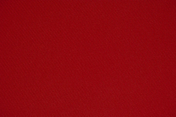 red textile in close up photography