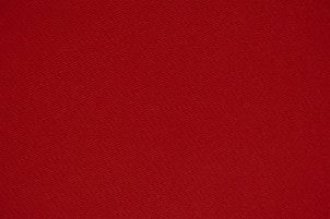 red textile in close up photography