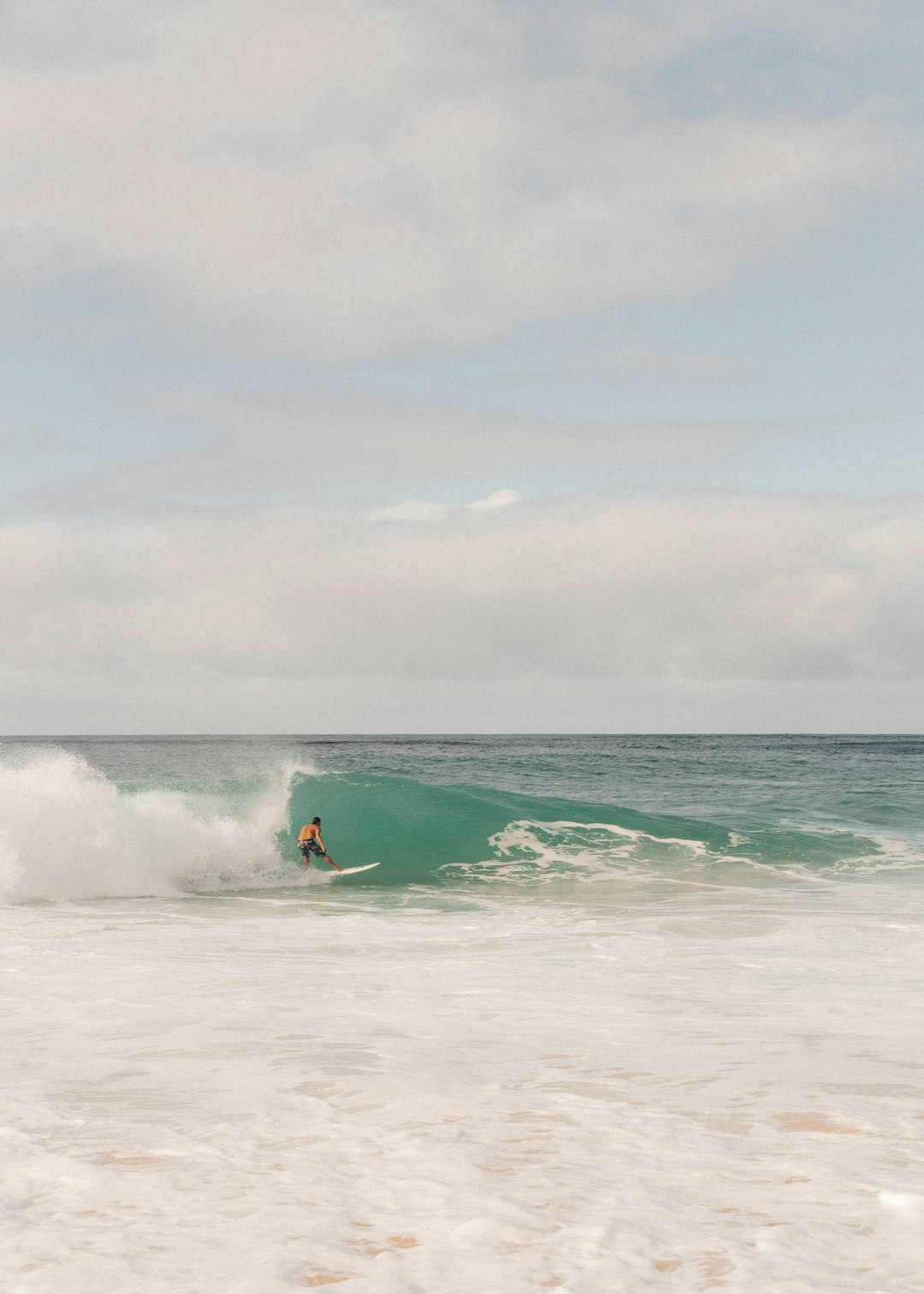 person surfing on sea waves during daytime