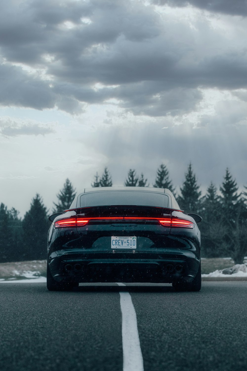 black bmw car on road during daytime