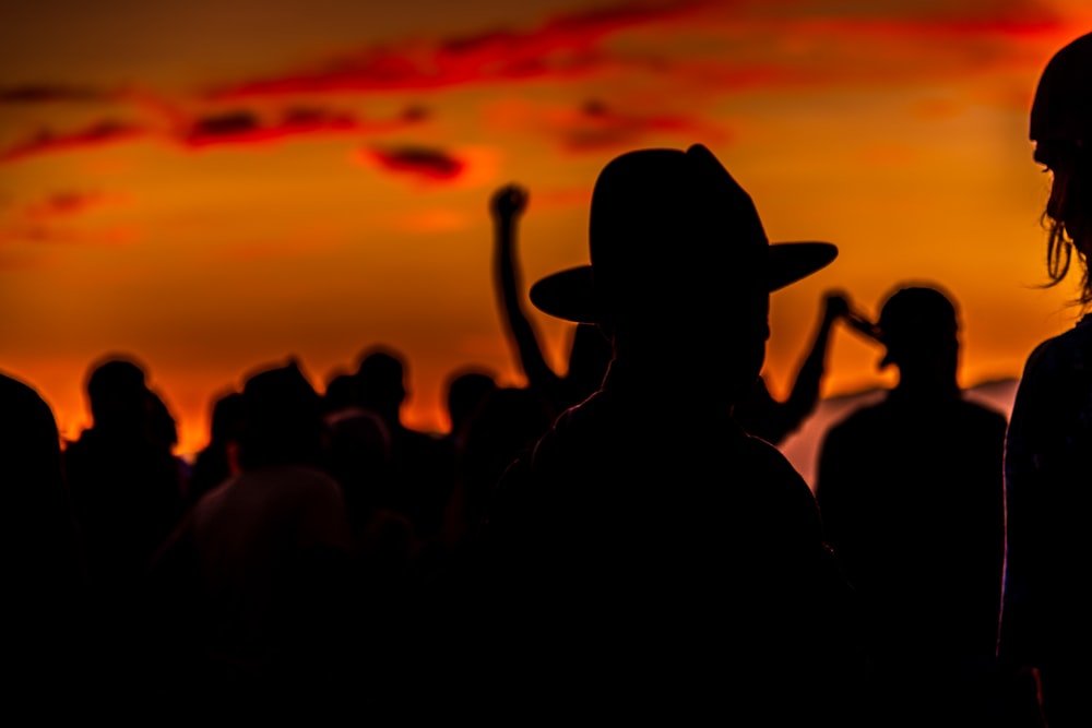 silhouette of people during sunset