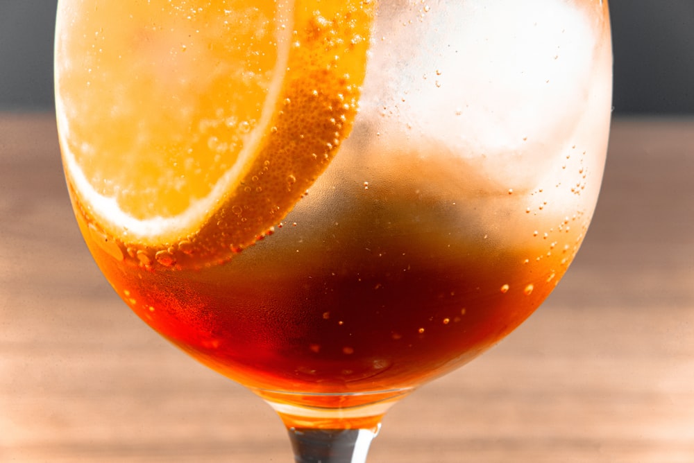 clear wine glass with orange liquid