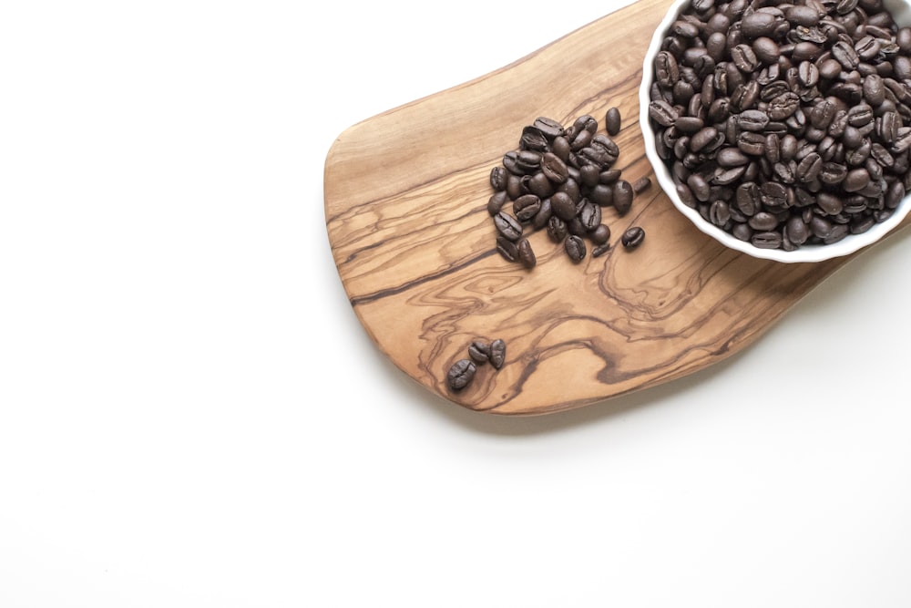 black beans on brown wooden chopping board