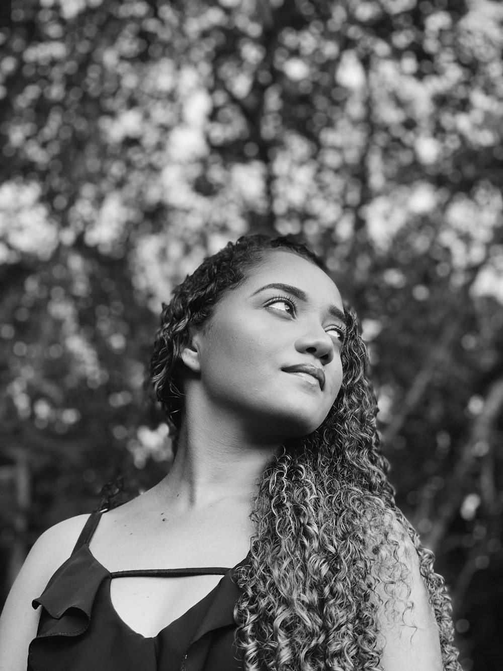 grayscale photo of woman in tank top