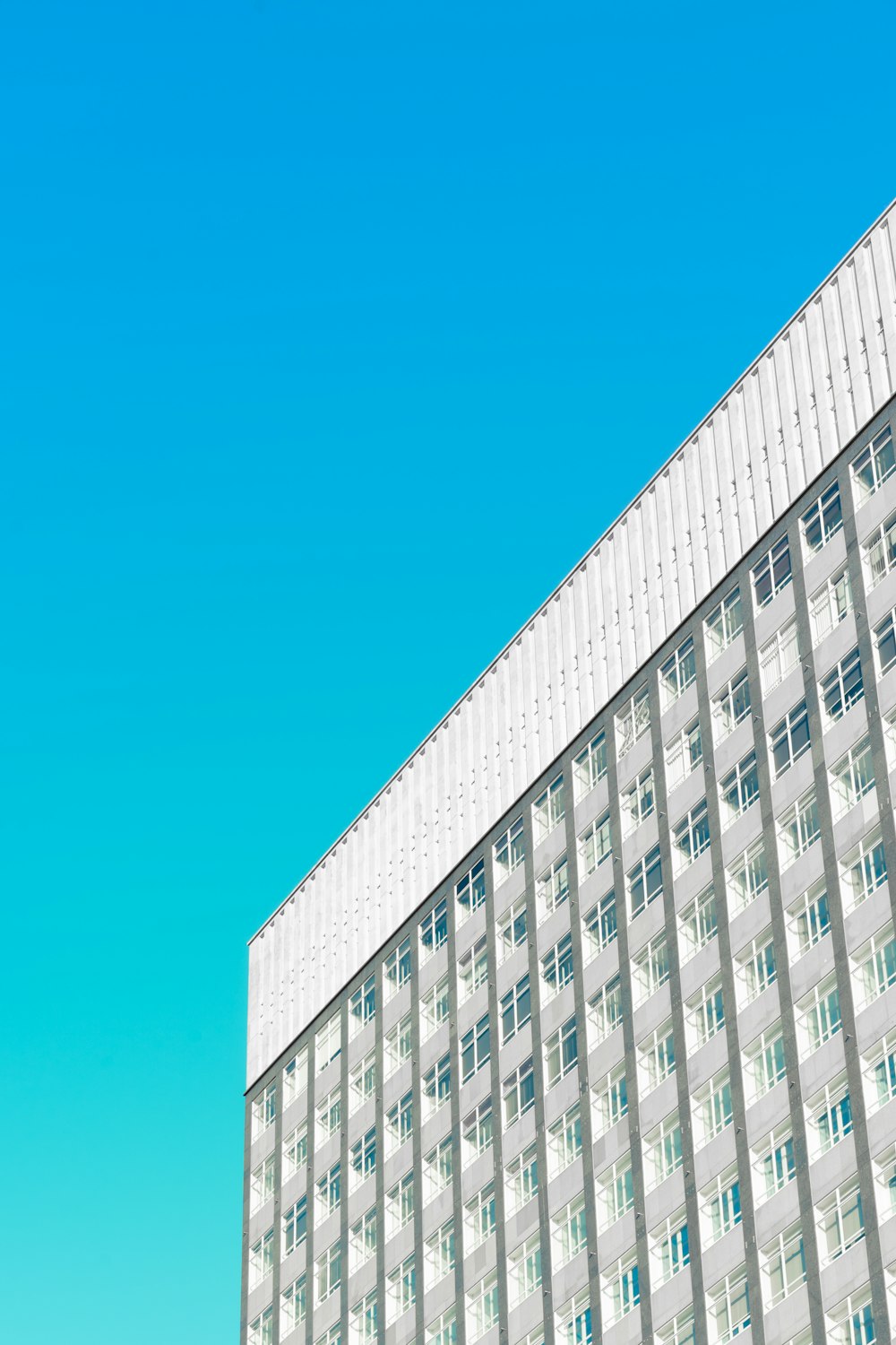 white concrete building under blue sky during daytime