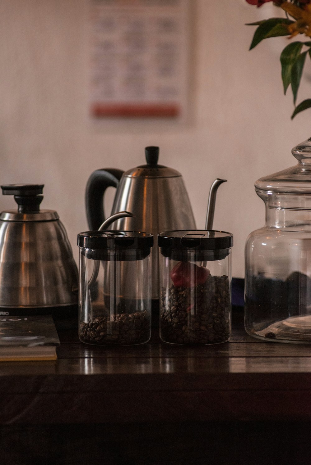 black coffee press beside clear glass jar