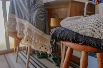 gray textile on brown wooden chair