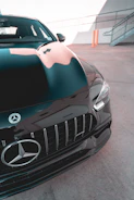 Close-up of a shiny silver Mercedes-Benz ready for shipment