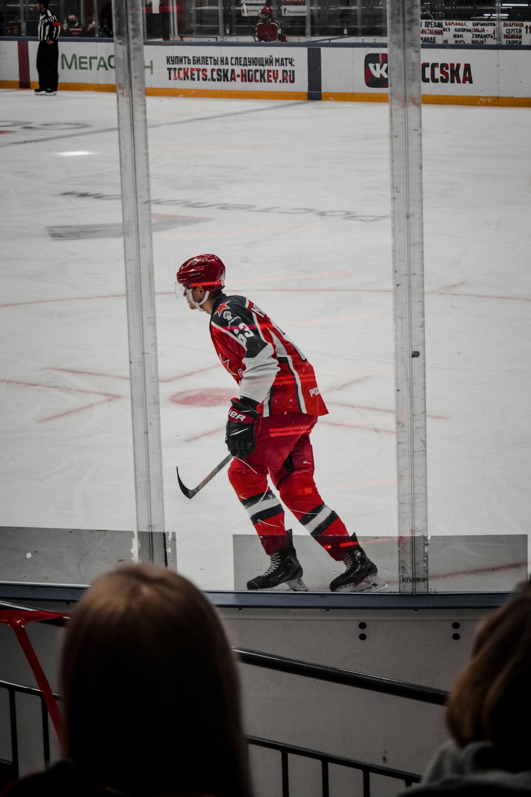 2 men in red and white ice hockey jersey