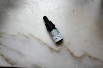 white and black plastic bottle