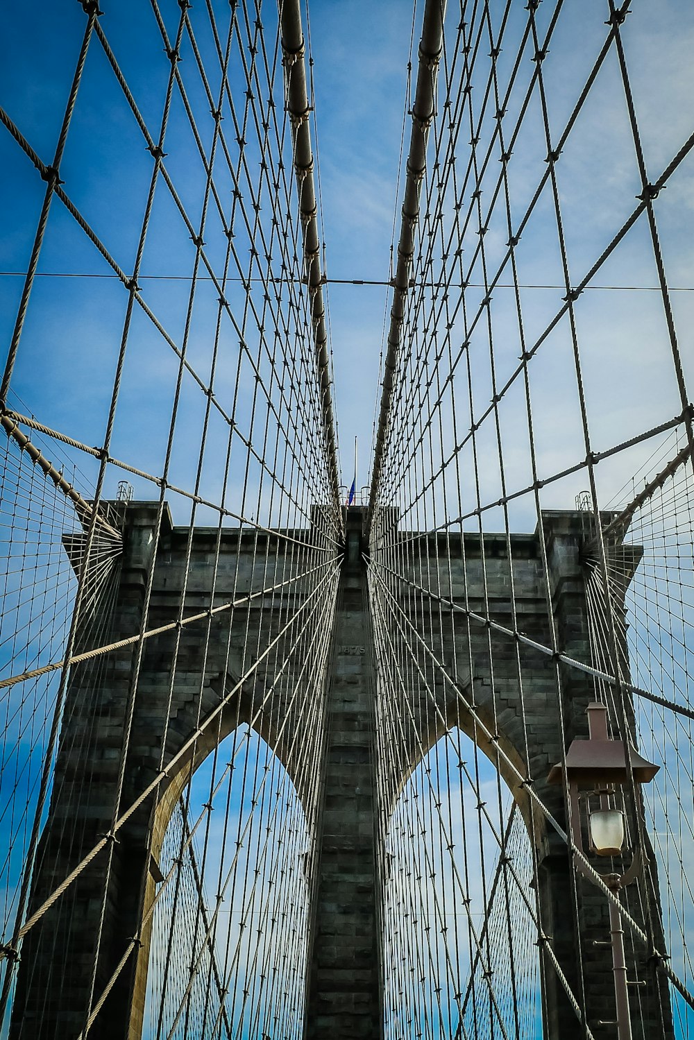 grey bridge under blue sky during daytime