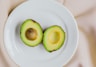 sliced avocado fruit on white ceramic plate