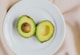 sliced avocado fruit on white ceramic plate