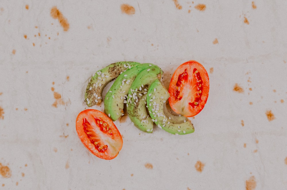 sliced cucumber and tomato on white ceramic plate