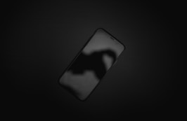 black iphone 5 on black textile