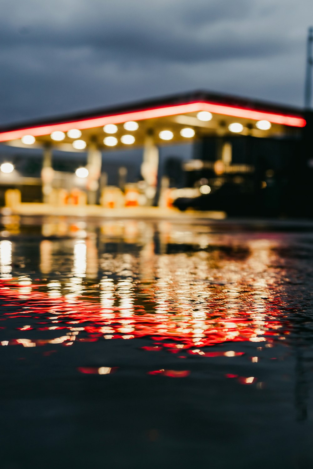 red lights reflecting on water