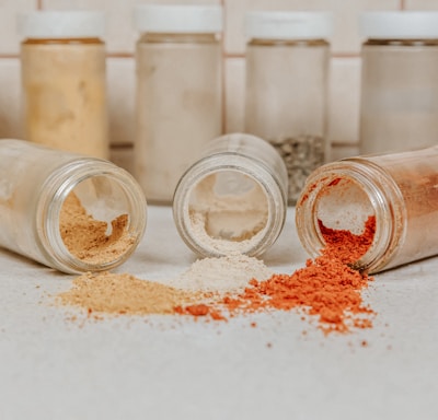 clear glass jars with white powder