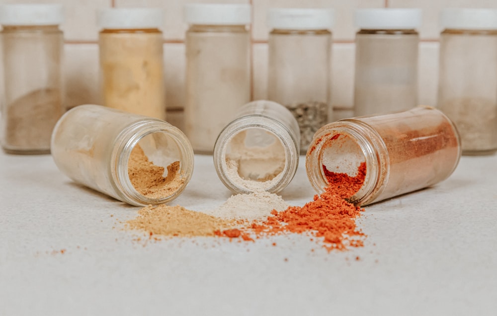 clear glass jars with white powder