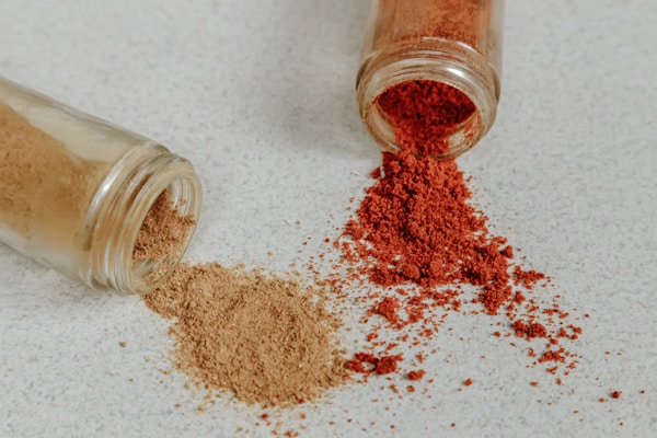 Brown powder on clear glass jar