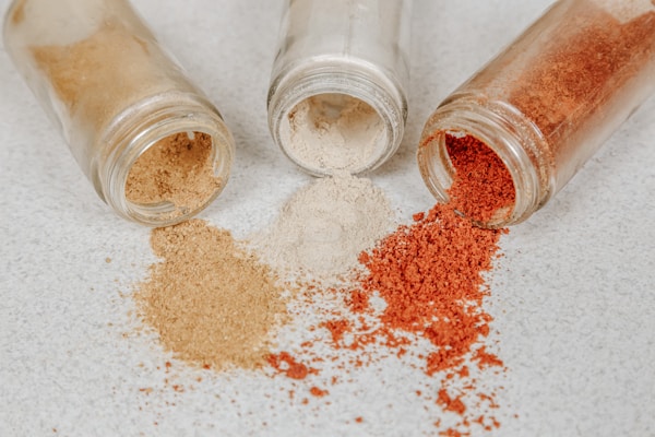 Brown powder in clear glass jar