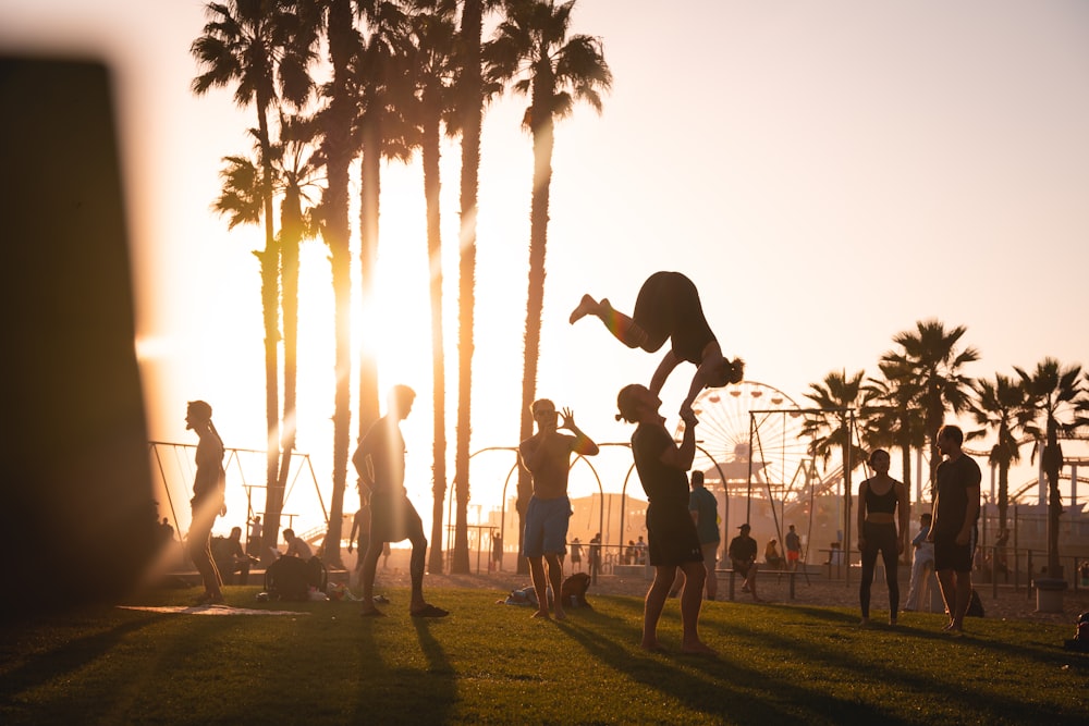 people playing basketball during daytime