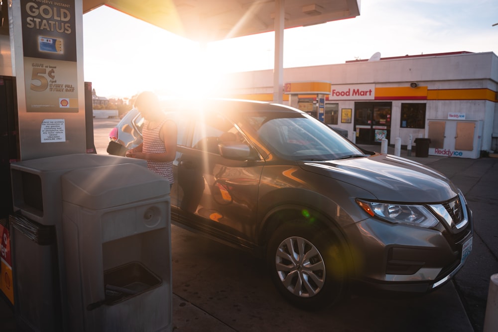 black honda sedan parked near white and gray food stall