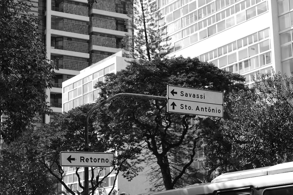 a black and white photo of a street sign