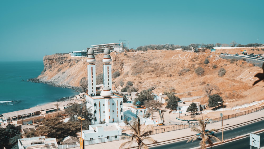 white concrete building near body of water during daytime