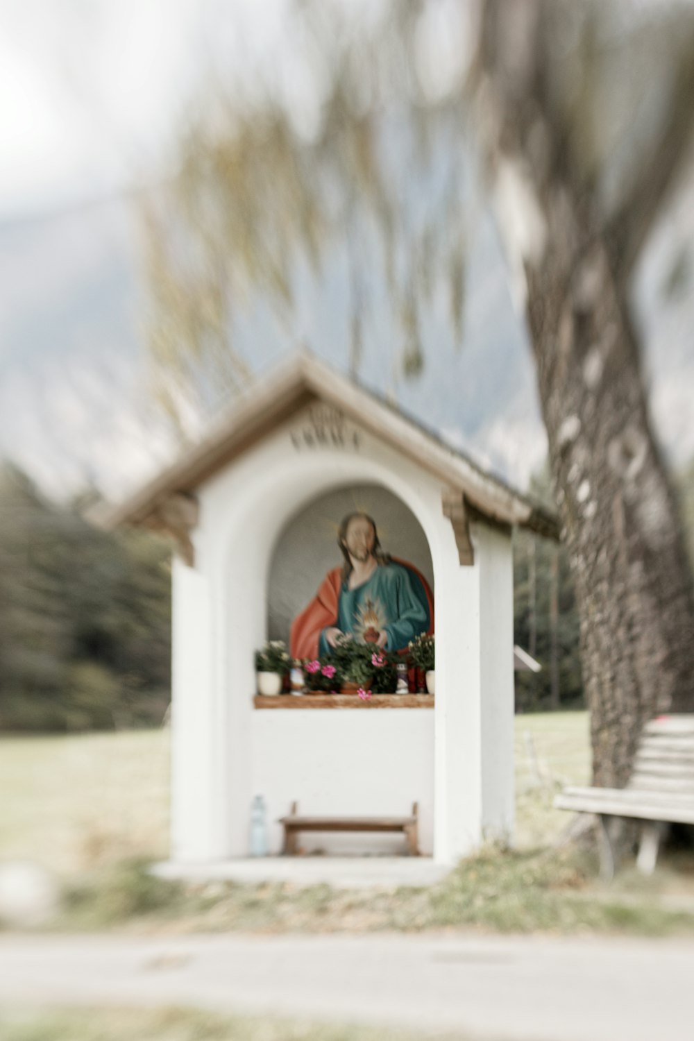 white wooden cross on white wooden table