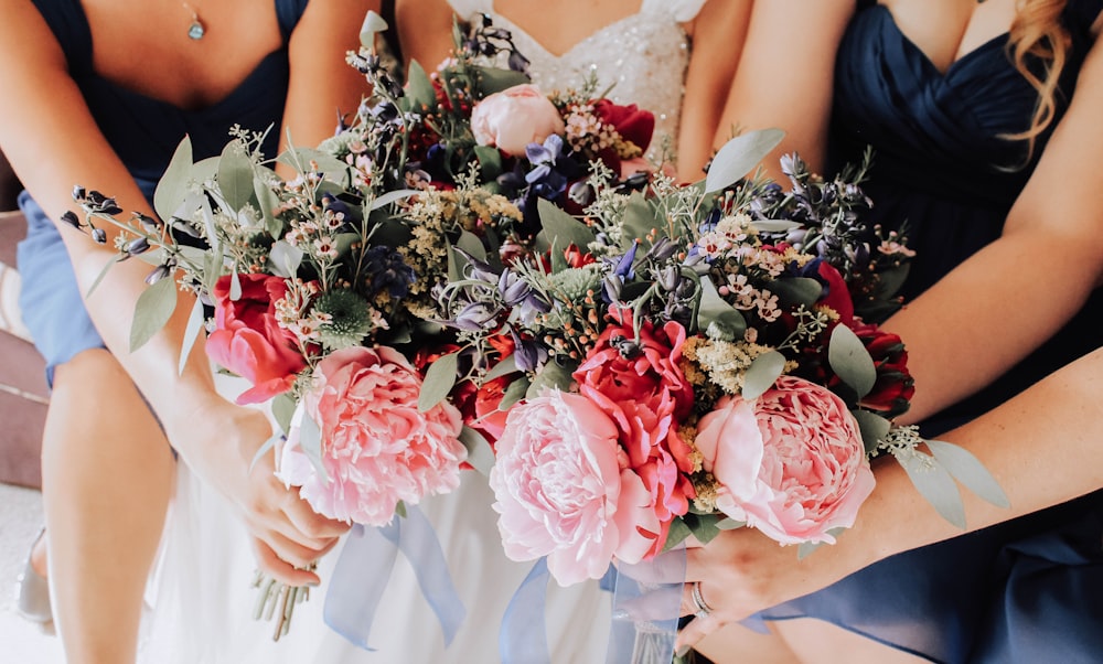 woman in white wedding dress holding bouquet of flowers