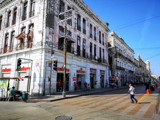 People walking on sidewalk near building during daytime — Mérida, Mexico