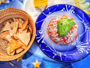 A colorful plate of fresh ceviche with lime and herbs, typical of Arica cuisine.