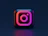 A three-dimensional Instagram logo icon with pink and orange gradient lighting