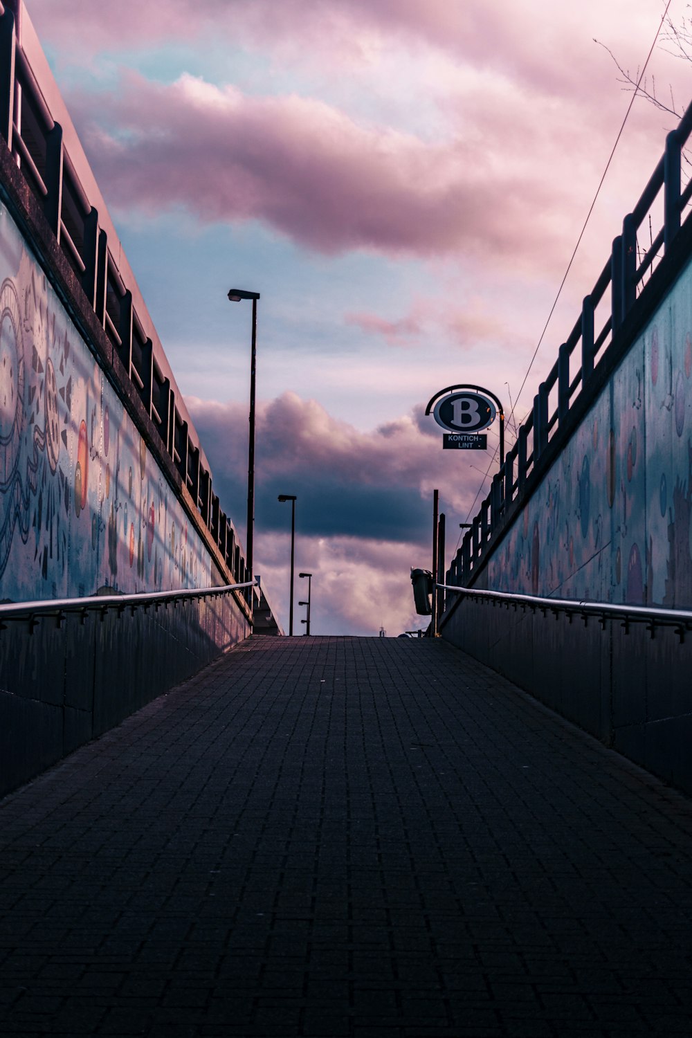 people walking on wooden bridge during daytime