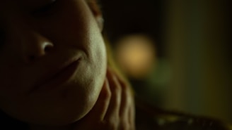 Close-up of a sensual, softly lit photograph emphasizing texture and shadow on skin.