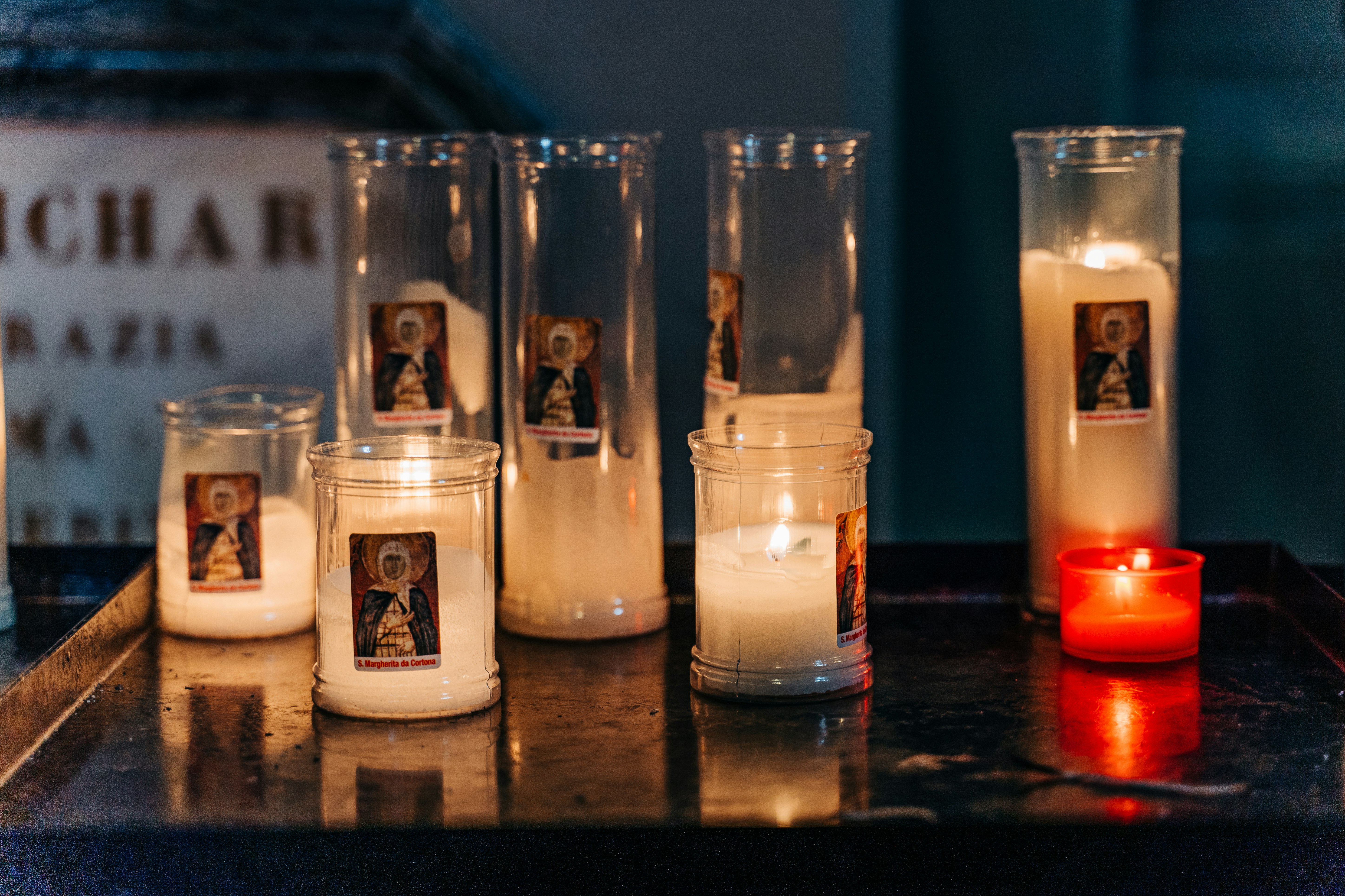 white candles on brown wooden table